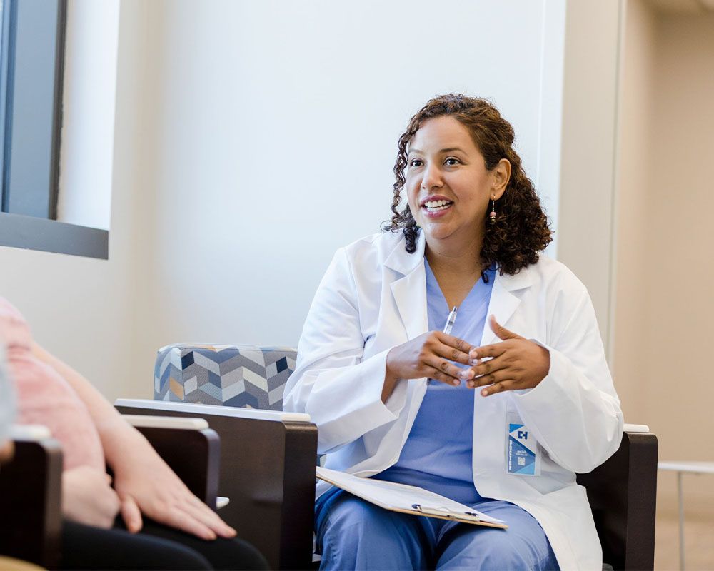 female doctor talking with patient