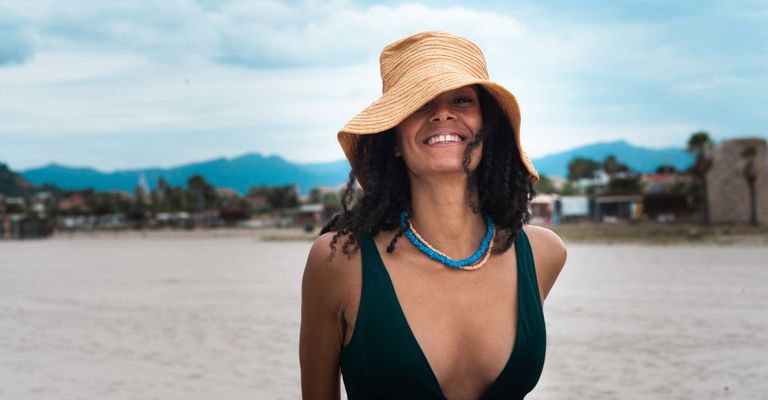 A happy woman on the beach.
