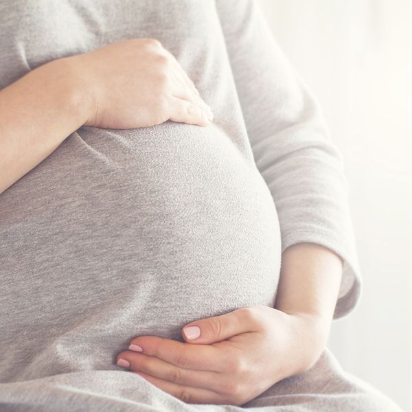 pregnant woman wearing warm clothes