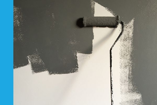 Paint roller on wall.