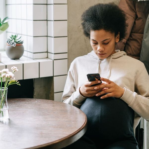 woman looking at phone 