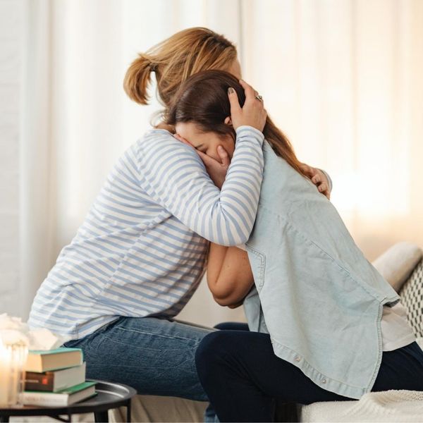 Two women consoling each other