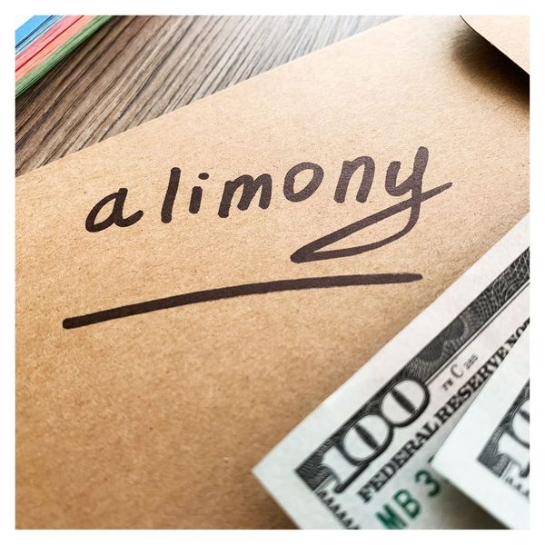 envelope with alimony written on it