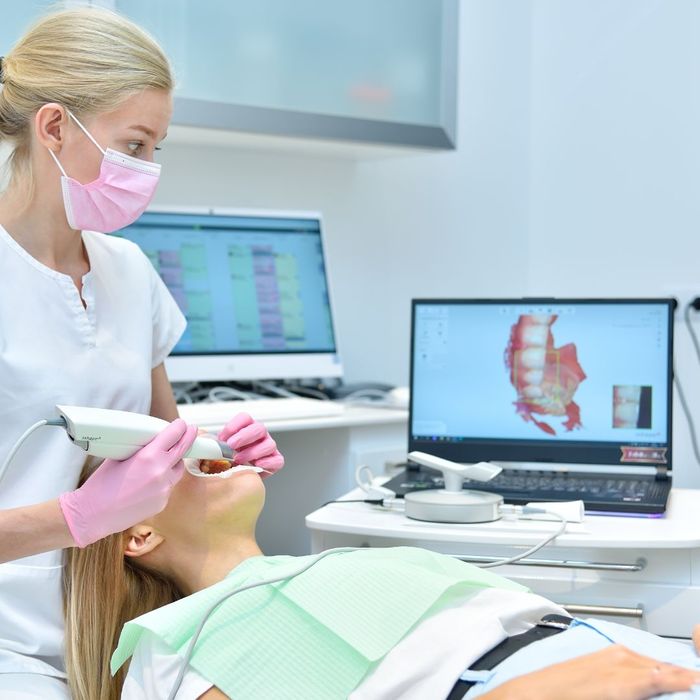 Orthodontist Scanning Patient with Dental Intraoral Scanner