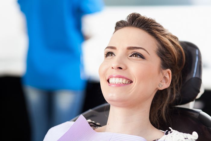 woman smiling in dental chair