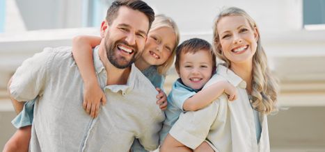 Happy family smiling after a dental visit in San Antonio
