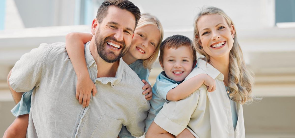 Happy family smiling after a dental visit in San Antonio