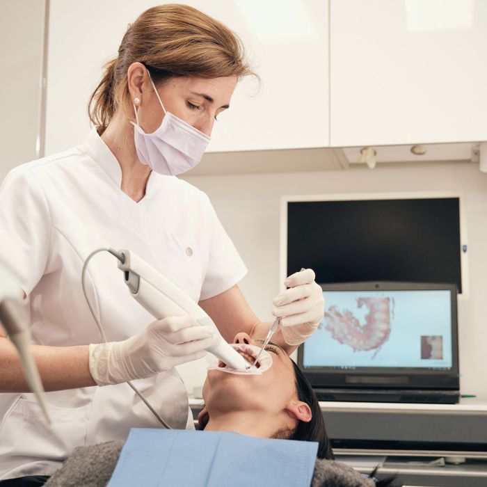 Dentist performing scans