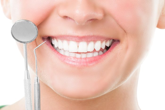 white smile with dental tools