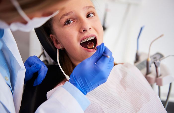 Child getting her braces checked