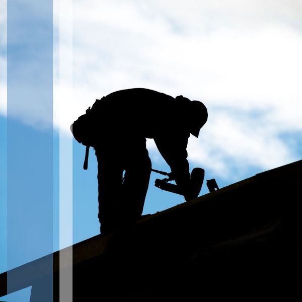 Arizona roofer using a drill on a roof repair