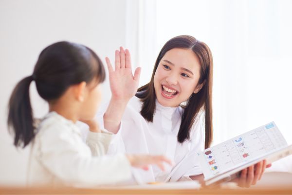 teacher working one on one with student