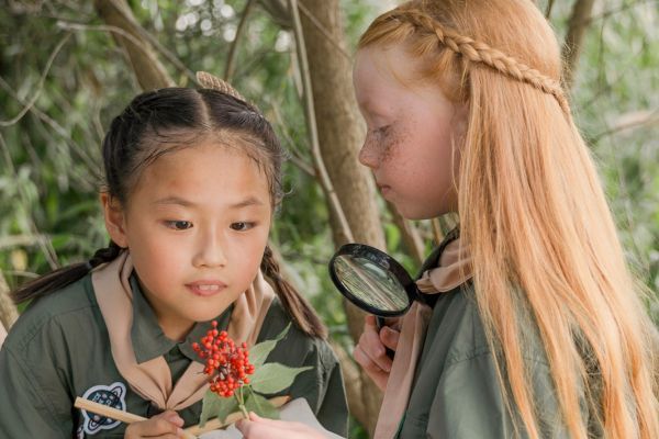 two girls studying plants 