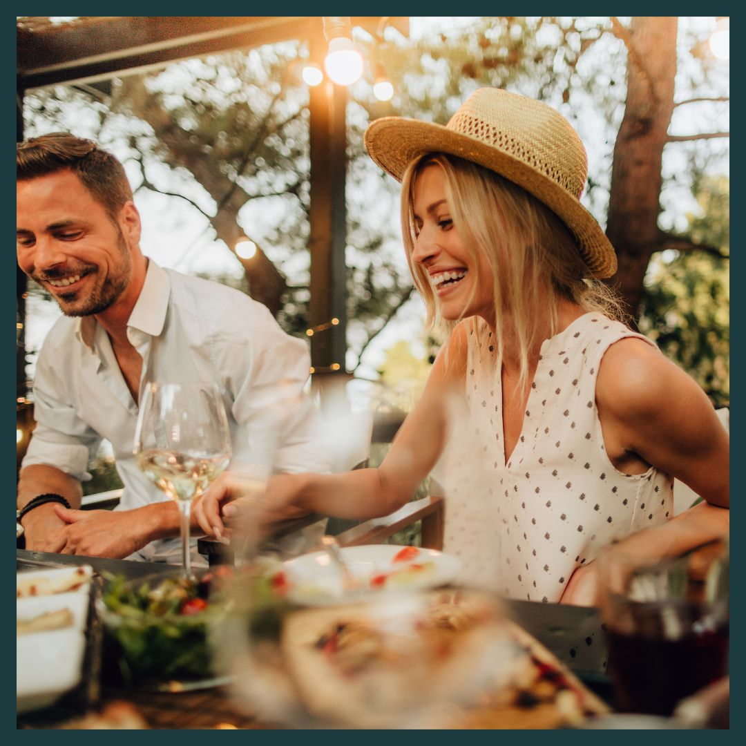 Woman laughing at dinner