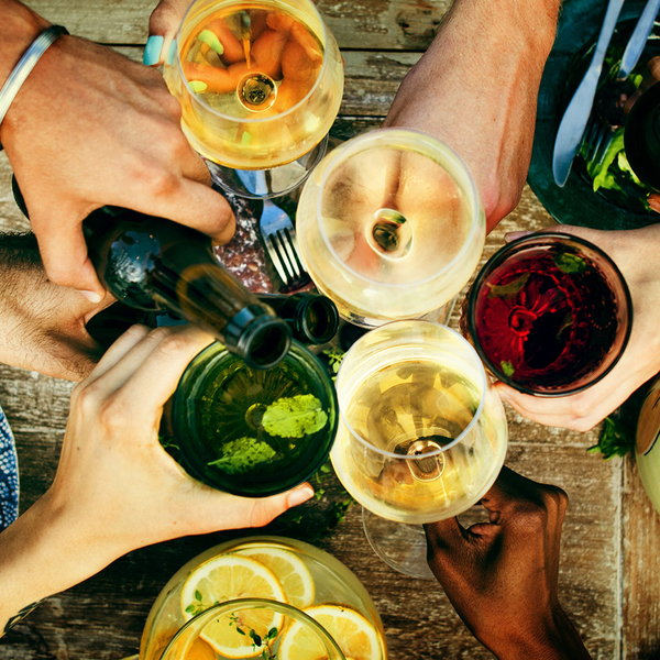 image of a group of people cheersing their beverages