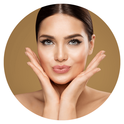 Woman posing with hands framing face, neutral background