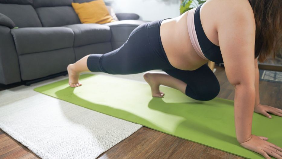 exercising at home on a mat 