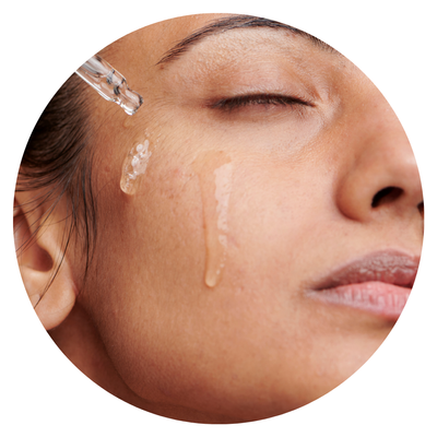 woman using a serum