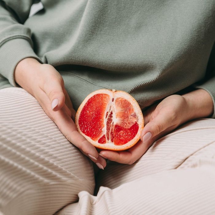 holding a grapefruit 
