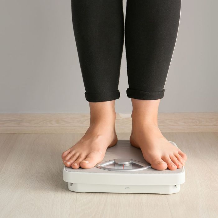 a person stepping on a scale