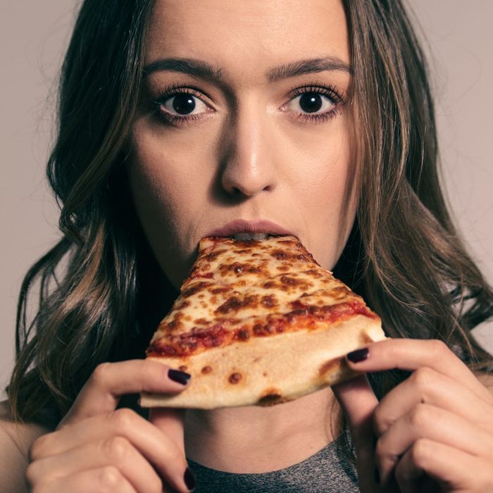 person eating pizza