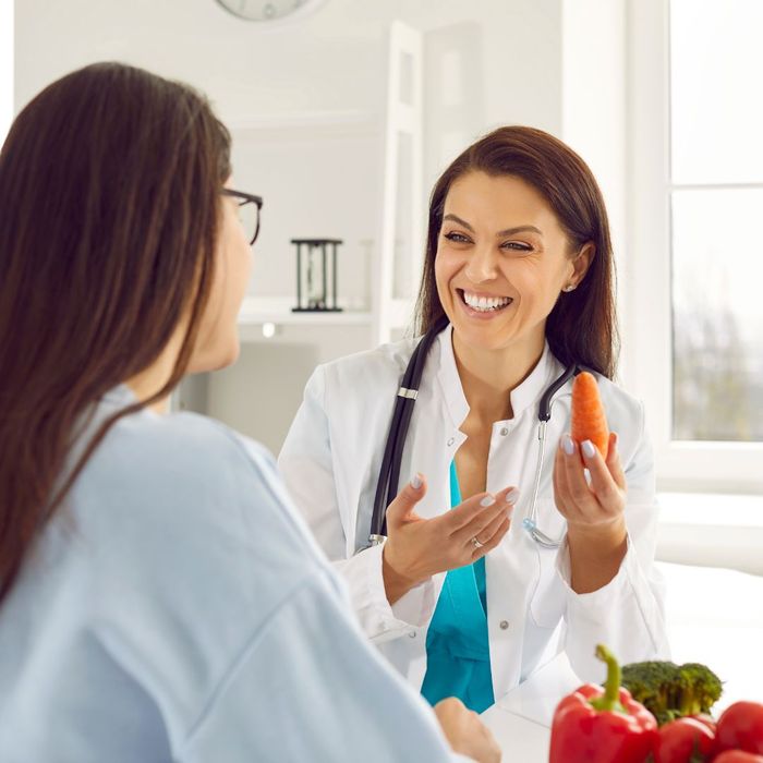 Doctor talking to woman about food
