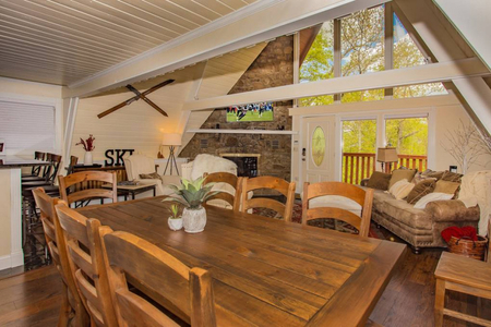 Fireplace, dinning room and great room in cabin living room.