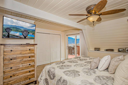 Bedroom in Ski View Getaway Cabin with TV