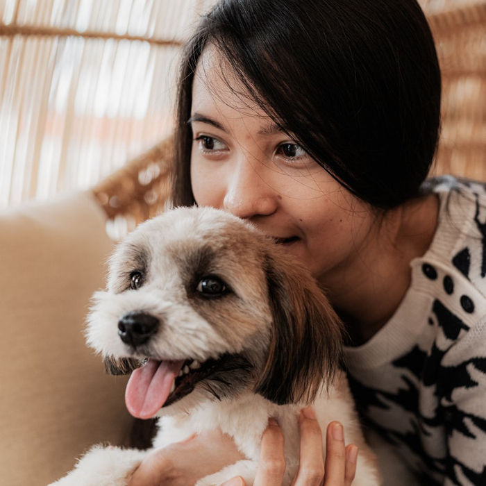 woman holding her dog