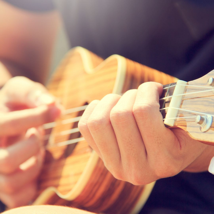 person playing a guitar