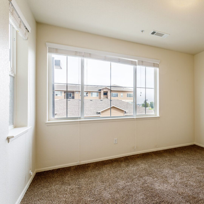 empty bedroom with large windows