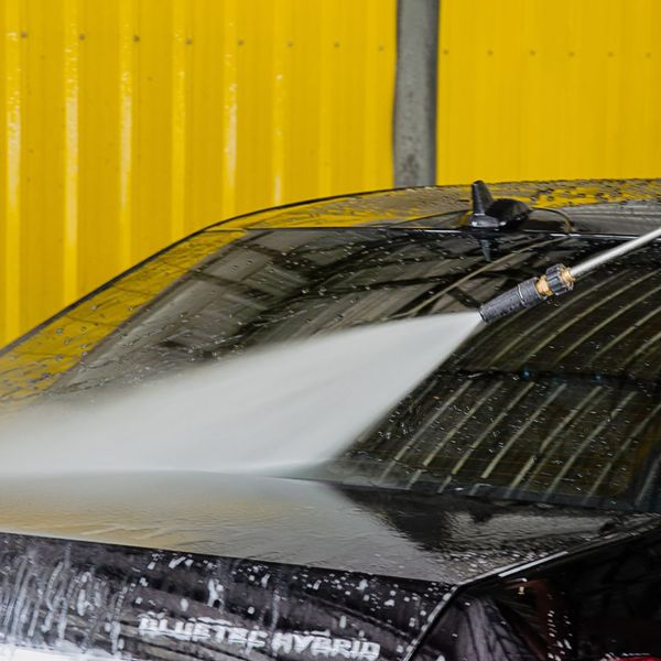 spraying car with water