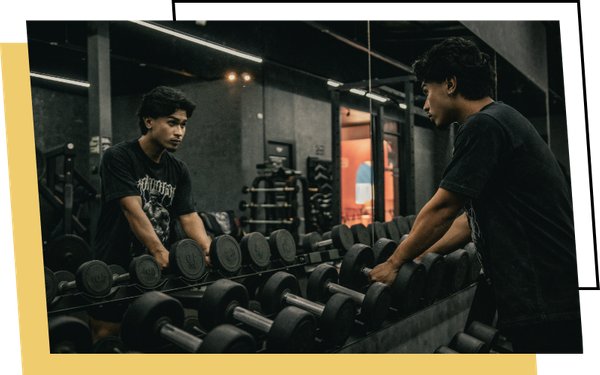 Person looking at themselves in gym mirror