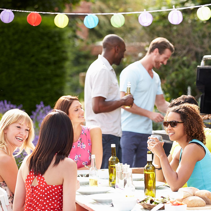 Neighbors having a backyard BBQ