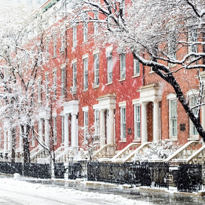 Line of city townhomes in snow