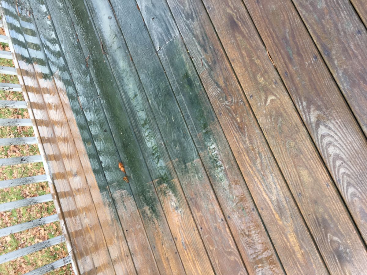 Pressure treated wood deck in Oxford getting pressure washed.