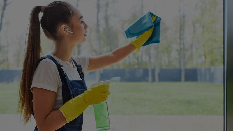 woman cleaning windows