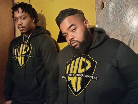 two men modeling the will power hoodies