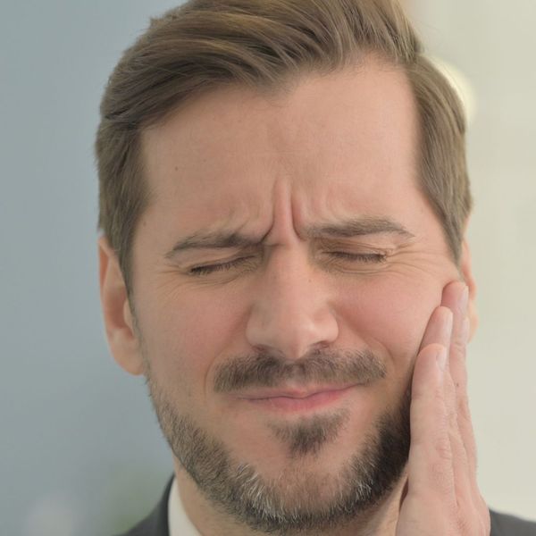 man with tooth pain man with tooth pain