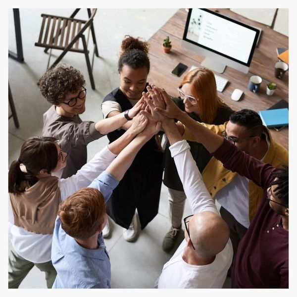 group of coworkers in a huddle