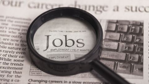 magnifying glass over the word jobs