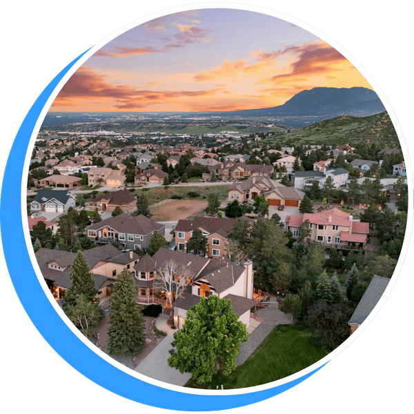 aerial view of suburban neighborhood with mountains in the background