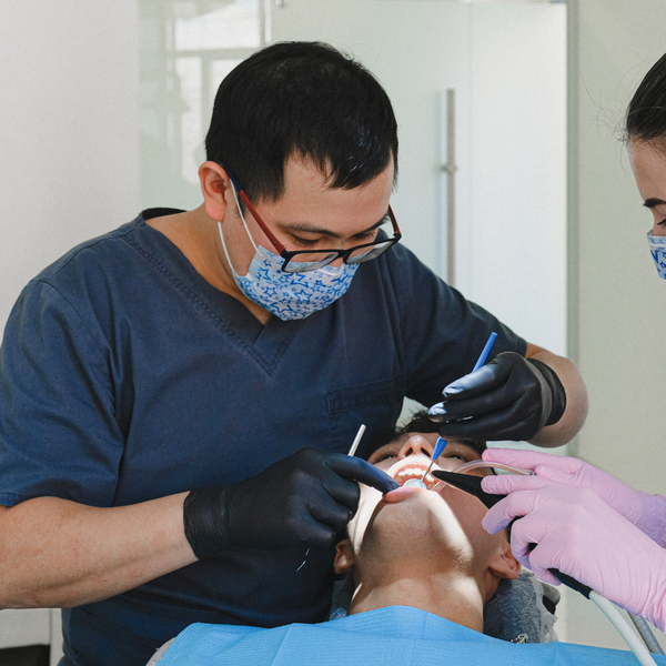 A dentist working on a patient