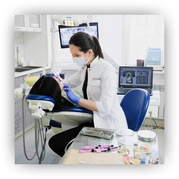 Dentist working with patient