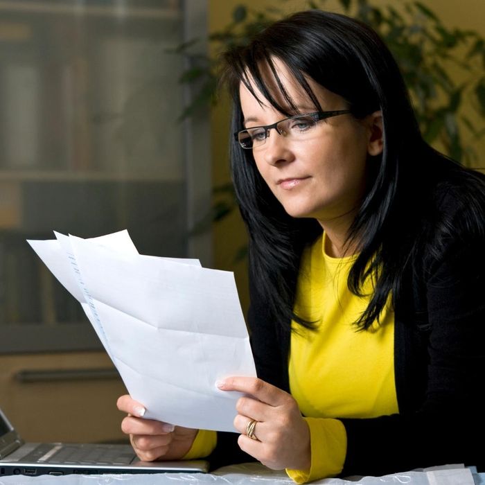 image of a woman paying bills