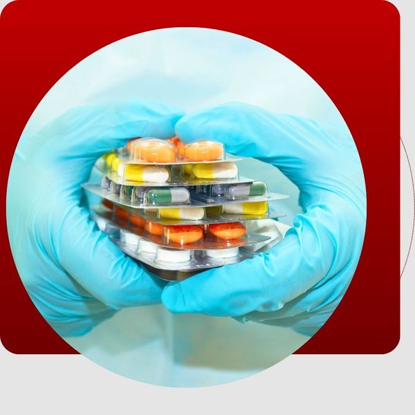 gloves holding pill packs gloves holding pill packs