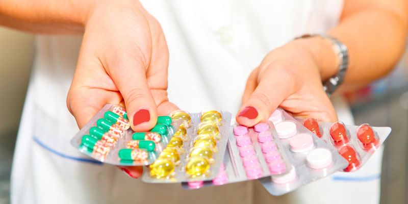 nurse holding pills