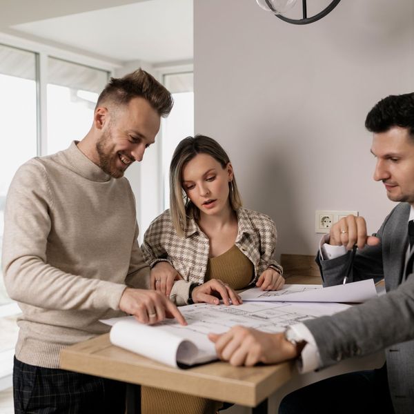 couple talking to real estate agent