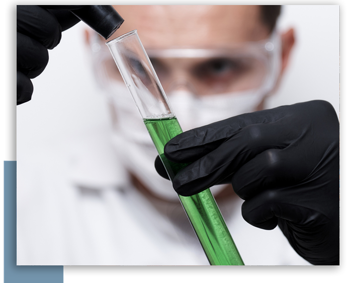 scientist looking at a tube