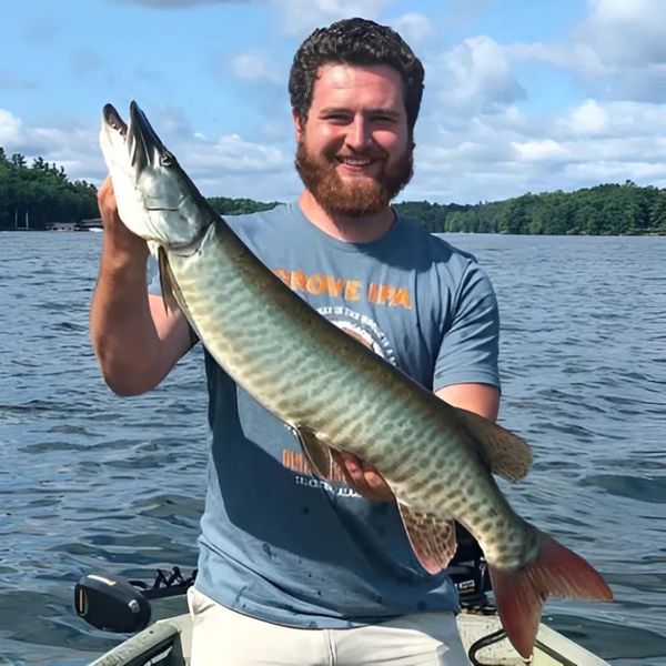 a man holding a musky Home.jpg